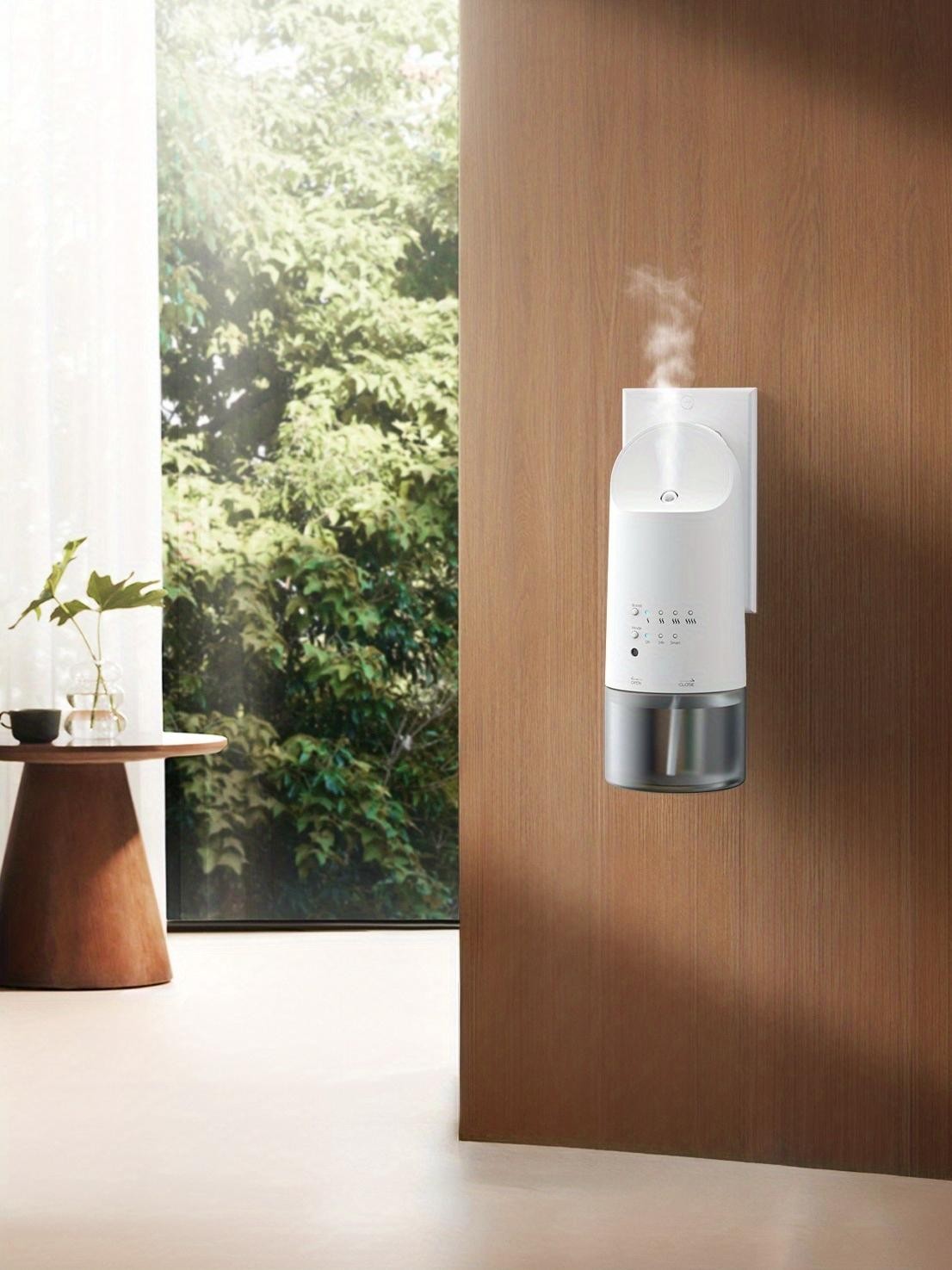 WSNUEEE A-P353 plug-in waterless diffuser mounted on a wooden wall panel, releasing a fine scent mist beside a window